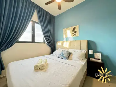 a bedroom with a bed with two towels on it at Cozy Retreat in the heart of KL by nbrichstay in Kuala Lumpur
