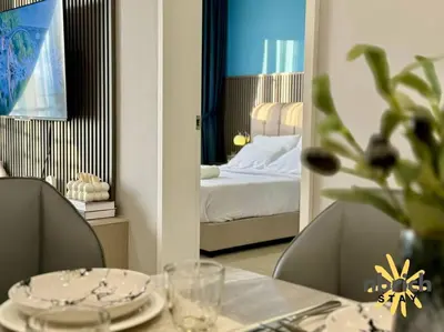 a room with a table and a bed and a mirror at Cozy Retreat in the heart of KL by nbrichstay in Kuala Lumpur