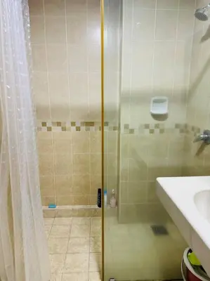 a shower with a glass door in a bathroom at Luxury Room Minutes from KLCC in Kuala Lumpur