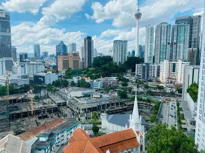 a view of a city with tall buildings and a tower at Luxury Room Minutes from KLCC in Kuala Lumpur