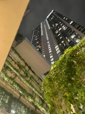 a view of two tall buildings at night at The Robertson Residence Kuala Lumpur in Kuala Lumpur