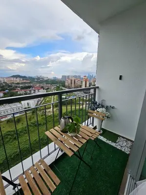 a balcony with a bench and a view of a city at Cozy Homestay KL Setapak 2R2B 1CarPark, Pool, Wifi, MALAYSIAN ONLY & MUS-LIM RECOMMENDED in Kuala Lumpur