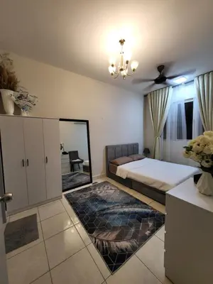 a bedroom with a large bed and a mirror at Cozy Homestay KL Setapak 2R2B 1CarPark, Pool, Wifi, MALAYSIAN ONLY & MUS-LIM RECOMMENDED in Kuala Lumpur