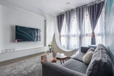 a living room with a couch and a table at M Vertica Kuala Lumpur by HLG Re in Kuala Lumpur