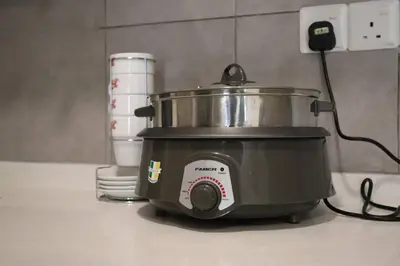 a slow cooker on a counter in a kitchen at M Vertica Kuala Lumpur by HLG Re in Kuala Lumpur