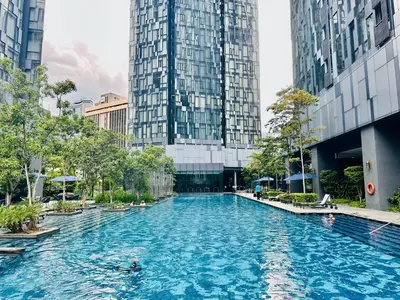 a swimming pool in a city with tall buildings at Star Residence KLCC By Starlight in Kuala Lumpur