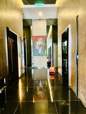 a hallway of a building with a painting on the wall at Star Residence KLCC By Starlight in Kuala Lumpur