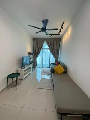 a living room with a couch and a ceiling fan at Skyhomes KLCC New in Kuala Lumpur
