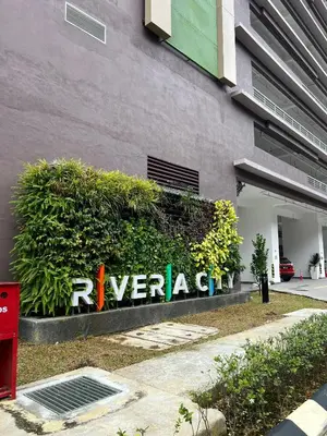 a sign on the side of a building at Riveria Suites, KL Sentral by Homebrickz in Kuala Lumpur