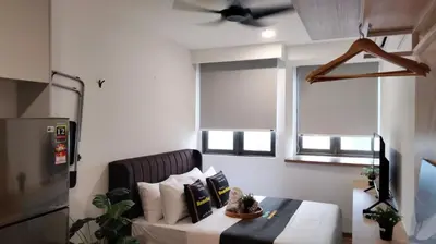 a living room with a couch and a table at Riveria Suites, KL Sentral by Homebrickz in Kuala Lumpur