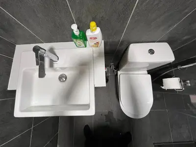 a bathroom with a sink and a toilet at THE COLONY INFINITUM Sweet Home SR in Kuala Lumpur