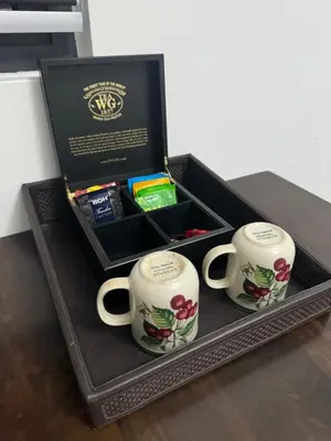 a gift box with two mugs on a table at KL City Nue Suites Entire Condo 2R2B 3 plus 1 guests in Kuala Lumpur