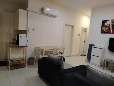 a living room with a couch and a table at 4R2B crest residences walk to klcc jln alor train 2station to bukitbintang water machine in Kuala Lumpur