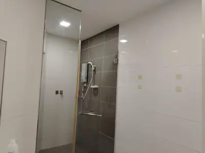 a shower with a glass door in a bathroom at 4R2B crest residences walk to klcc jln alor train 2station to bukitbintang water machine in Kuala Lumpur