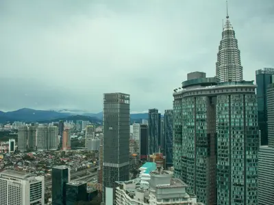 an aerial view of a city with a tall skyscraper at Vortex Apartments Kuala Lumpur in Kuala Lumpur