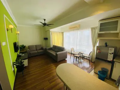 a living room with a couch and a table at Luxury Room At Bukit Bintang in Kuala Lumpur