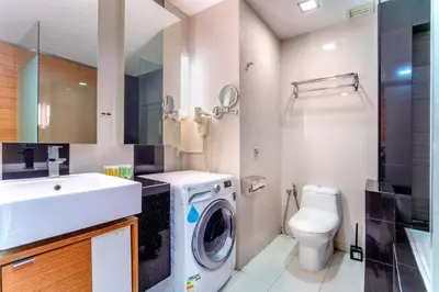 a bathroom with a washing machine and a sink at Dua Sentral 2km to KL Sentral in Kuala Lumpur