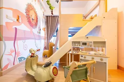 a childs room with a play kitchen and a doll house at KidsVille Shamelin Star KLCC View Infinity Pool in Kuala Lumpur