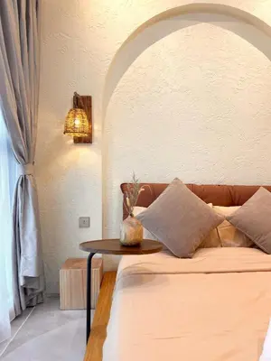 a living room with a couch and a table at The Little Bali - Karaoke - 4 Pax in Kuala Lumpur
