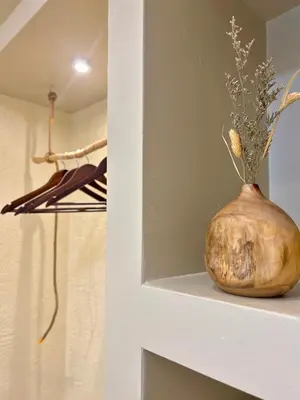 a vase sitting on a shelf in a closet at The Little Bali - Karaoke - 4 Pax in Kuala Lumpur