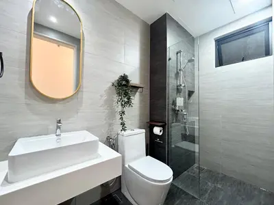a bathroom with a sink and a toilet and a shower at The Little Bali - Karaoke - 4 Pax in Kuala Lumpur
