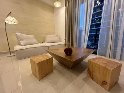 a living room with a couch and a coffee table at The Little Bali - Karaoke - 4 Pax in Kuala Lumpur