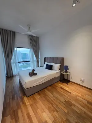 a bedroom with a bed and a large window at Reizz Residence by Perkasa Suites in Batu Empat