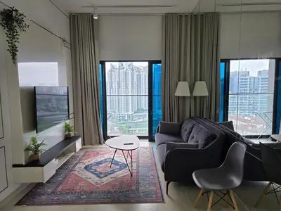 a living room with a couch and a table at Reizz Residence by Perkasa Suites in Batu Empat