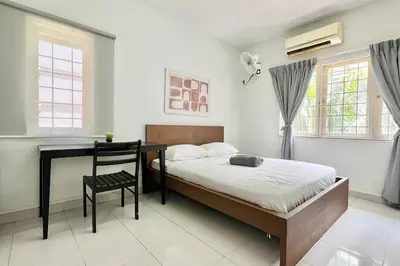 a bedroom with a bed and a desk and a chair at 3BR Family Stay at Desa Pandan KL ready Wifi Netflix in Kuala Lumpur