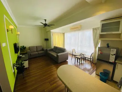 a living room with a couch and a table at place to stay At Bukit Bintang in Kuala Lumpur