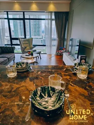 a living room with a view of a building at Anggun Residence near KLCC Serviced Suite in Kuala Lumpur