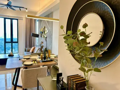 a living room with a large mirror on the wall at KL Sentral 28th Floor CityCenter in Kuala Lumpur