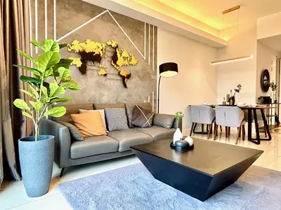 a living room with a couch and a table at KL Sentral 28th Floor CityCenter in Kuala Lumpur