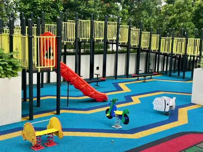a playground with a red slide and play equipment at KL Sentral 28th Floor CityCenter in Kuala Lumpur