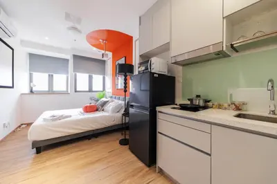 a kitchen with a bed in the middle of it at Riveria City KL Sentral by Sleepy Bear in Kuala Lumpur