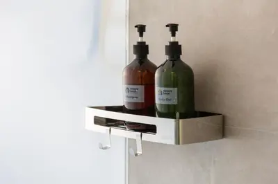 two bottles of wine in a holder on a wall at Riveria City KL Sentral by Sleepy Bear in Kuala Lumpur