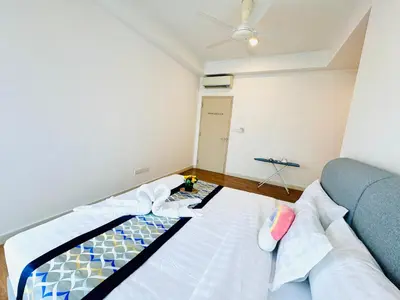 a bedroom with a bed and a ceiling fan at Velocity Residence linkway Sunway mall in Kuala Lumpur