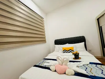 a bedroom with a bed with a stuffed animal on it at Velocity Residence linkway Sunway mall in Kuala Lumpur