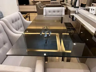 a living room with a glass table and chairs at Dorsett Bukit Bintang with Bathtub by Prestige in Kuala Lumpur