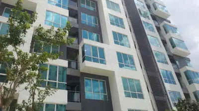 a tall building with many windows on it at Setapak Central KL - Zetapark Spring Suites in Kuala Lumpur