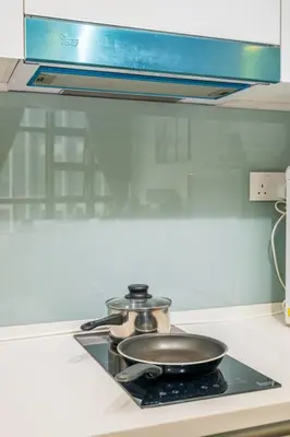 a pan sitting on top of a stove in a kitchen at EkoCheras max5pax Romance Retreats #freeparking #netflix #wifi in Kuala Lumpur