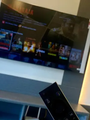 a remote control sitting in front of a tv at TOP FLOOR 3BR apartment in KL for 6Pax in Kuala Lumpur