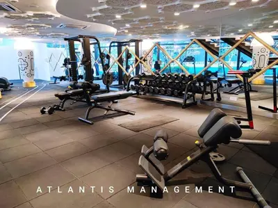 a gym with treadmills and exercise equipment on a ship at Arte Mont Kiara in Kuala Lumpur