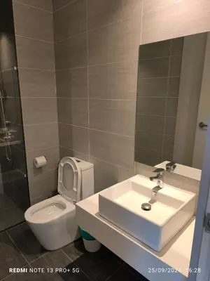 a bathroom with a sink and a toilet at Trion by sweet home in Kuala Lumpur