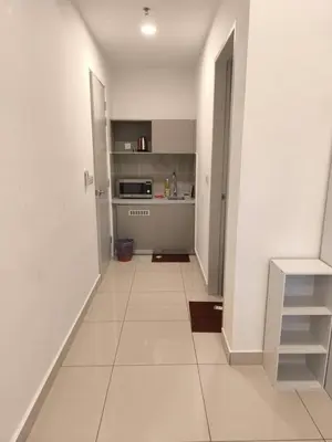 a room with a kitchen and a hallway at Trion By Awesome Apartment Stay in Kuala Lumpur