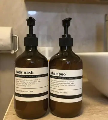 two bottles of laundry detergent sitting on a counter at Bintang Fairlane Residence, KLCC & City View - 2B1R in Kuala Lumpur