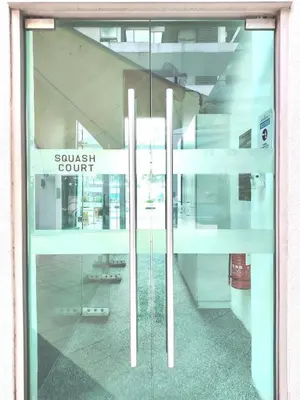a glass door with the words sussex court on it at Swiss Garden Bukit Bintang in Kuala Lumpur