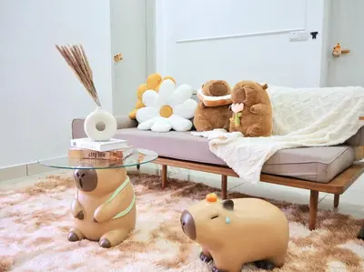 a group of stuffed animals sitting on a couch at Capybara Trion KL View in Kuala Lumpur