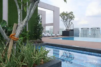 a swimming pool on the roof of a building at Awesomestay apartment walk to Tun Sambathan near KL Sentral in Kuala Lumpur