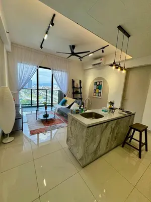 a kitchen with a sink and a living room at trion2 klcc in Kuala Lumpur